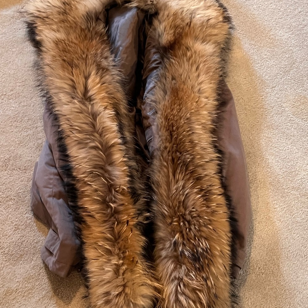 Mens tan parka with coyote trim. Size Large